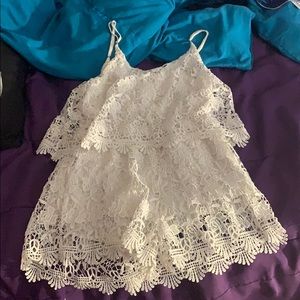 White spaghetti strap romper with flower patterns